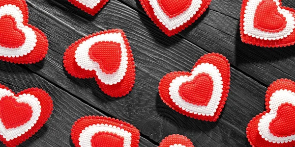 Flat view of valentines hearts on dark wooden background — Stockfoto