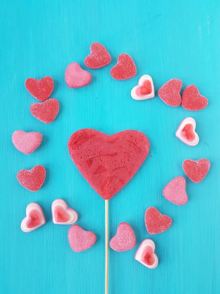 Heart shape lollipop and heart shape jelly candies — Stock Photo, Image