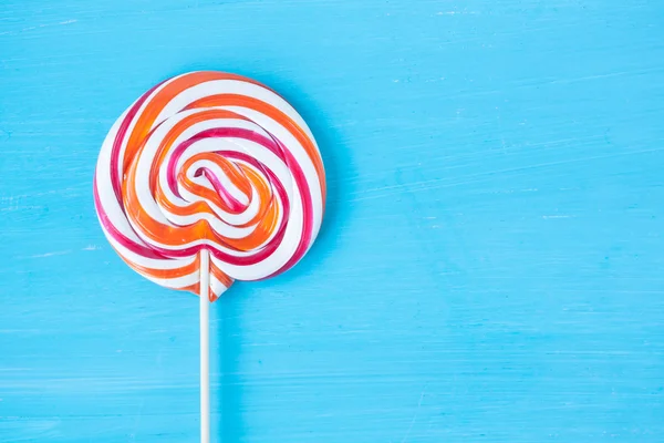 Lollipop candy on a turquoise background — Stock Photo, Image