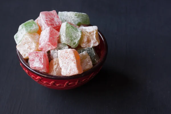 Turkish delight lokum on a black background — Stock Photo, Image