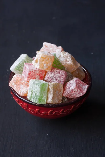 Turkish delight lokum on a black background — Stock Photo, Image