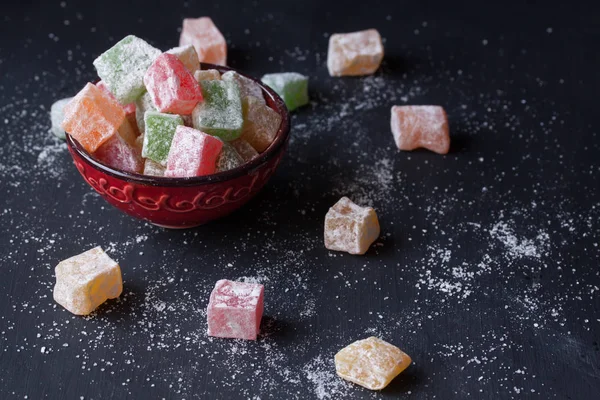 Turkish delight lokum on a black background — Stock Photo, Image