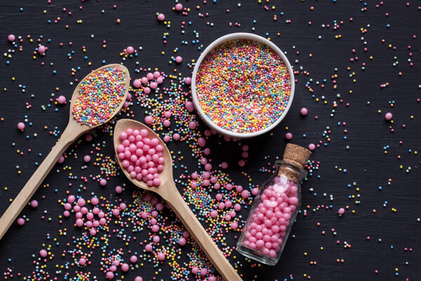 Sugar sprinkles on a black background