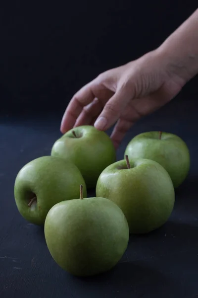 Green apples on a black background — Stock Photo, Image