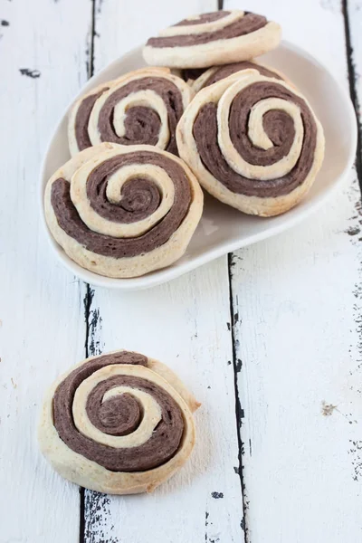 Spiral  cookies on a white wooden background — Stock Photo, Image