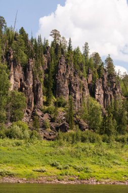 Big river of Eastern Siberia. Tunguska. Fantastical cliffs. Krasnoyarsk territory. clipart