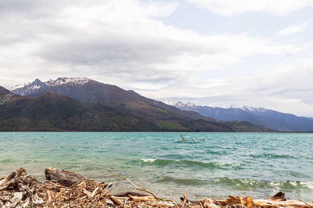 Wanaka lake. Snow, stones and water. South Island, New Zealand