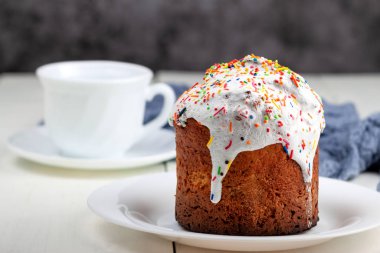 Easter cake with a cup of tea in the background