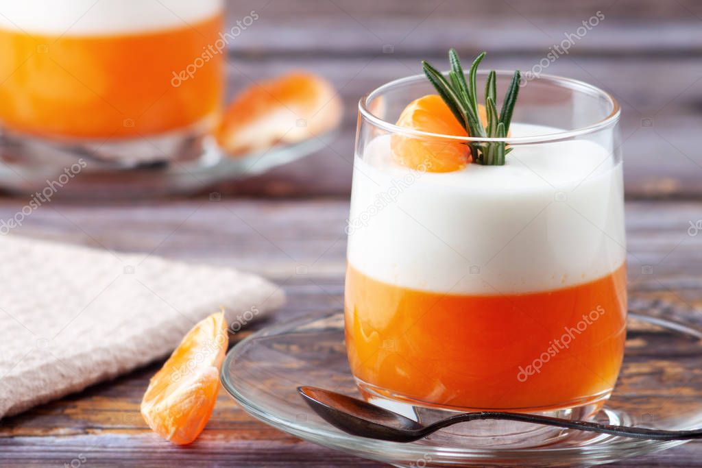 Italian dessert, Panna Cotta with tangerines, jelly and rosemary, home cooking. Copy space