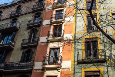 Brightly colored buildings in Placa de Sant Josep Oriol (Saint Joseph Oriol square) in Barcelona, Spain.