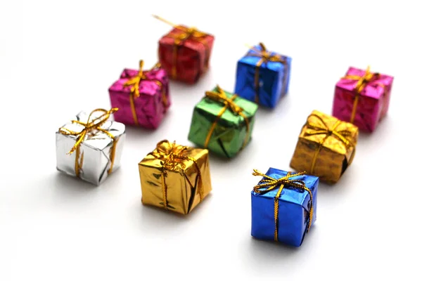 Colored gift boxes on a white background. Happy holiday. — Stock Photo, Image