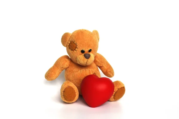 Medvídek s červeným srdcem na bílém pozadí. — Stock fotografie