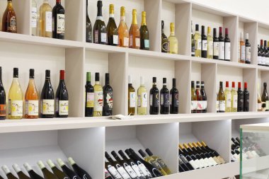 Many different bottles of wine and champagne.