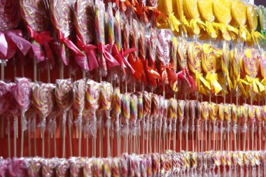Candy on a stick. Mixed colorful fruit sweets.