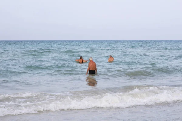 Elderly People Entering Sea Old Men Beach Happy Retirement Rest — Stock Photo, Image