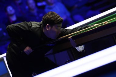 Yan Bingtao of China plays a shot to Shaun Murphy of England at the semifinal of 2020 Players Championship in Southport, the United Kingdom, 29 February 2020 clipart
