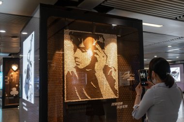 An exhibition of covers of Taiwanese singer Jay Chou's albums, which are composed of over 50 thousand pieces of biscuits, is held at a metro stop in Shanghai, China, 21 May 2020. clipart