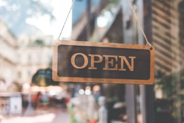 sign open on the door of the restaurant. open signboard