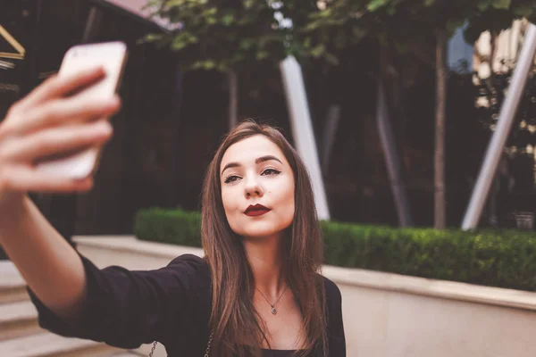 Closeup selfie portrait of a serious lady