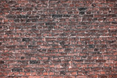 Eski tuğla desen, koyu duvar.