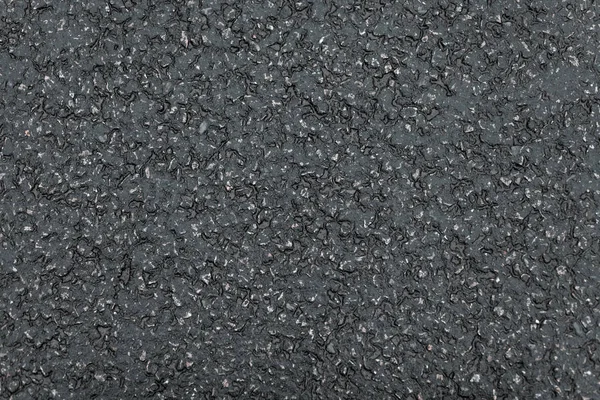 Black asphalt texture, dark background
