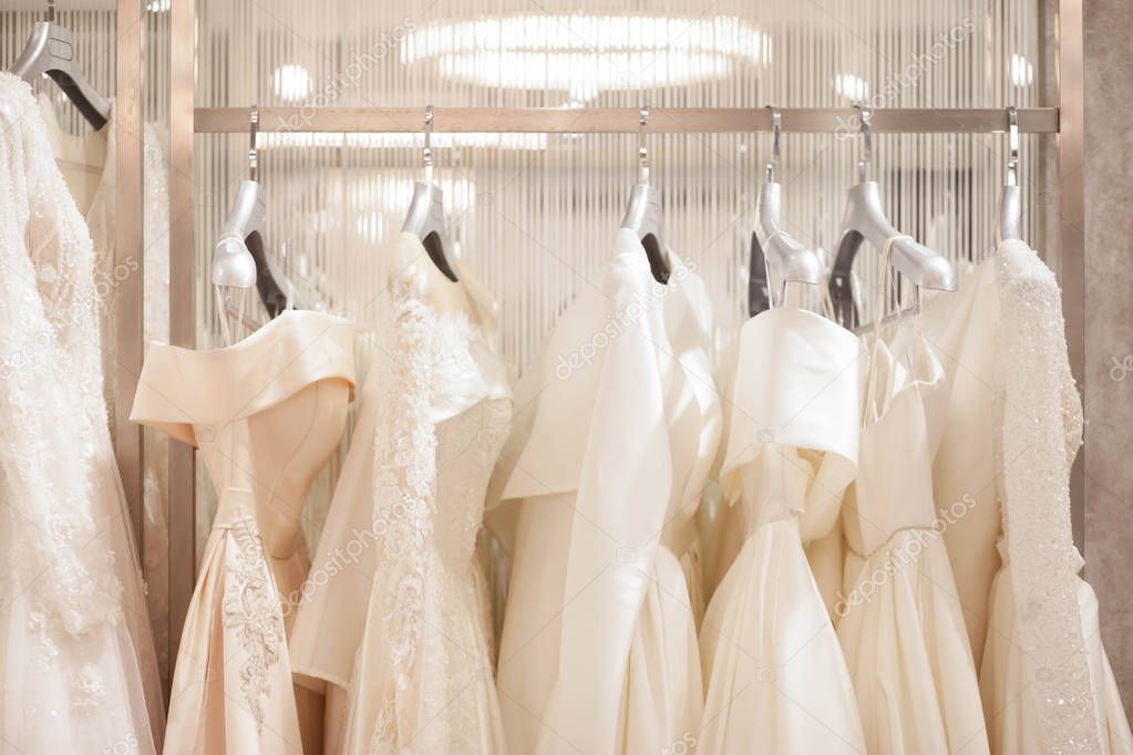 Elegant dresses in the wedding salon. The choice of wedding dresses in the store