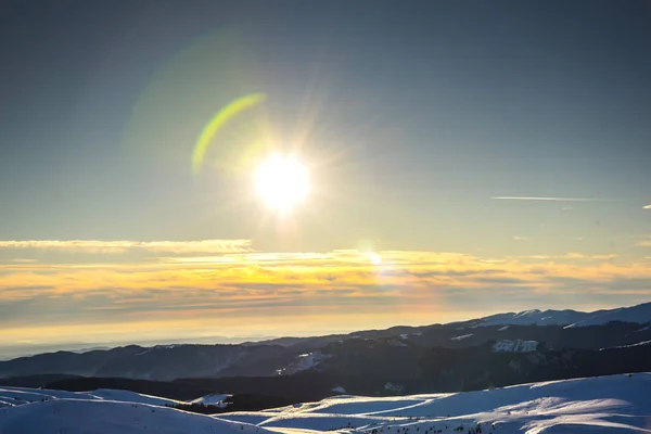 mountain landscape with snow and sun