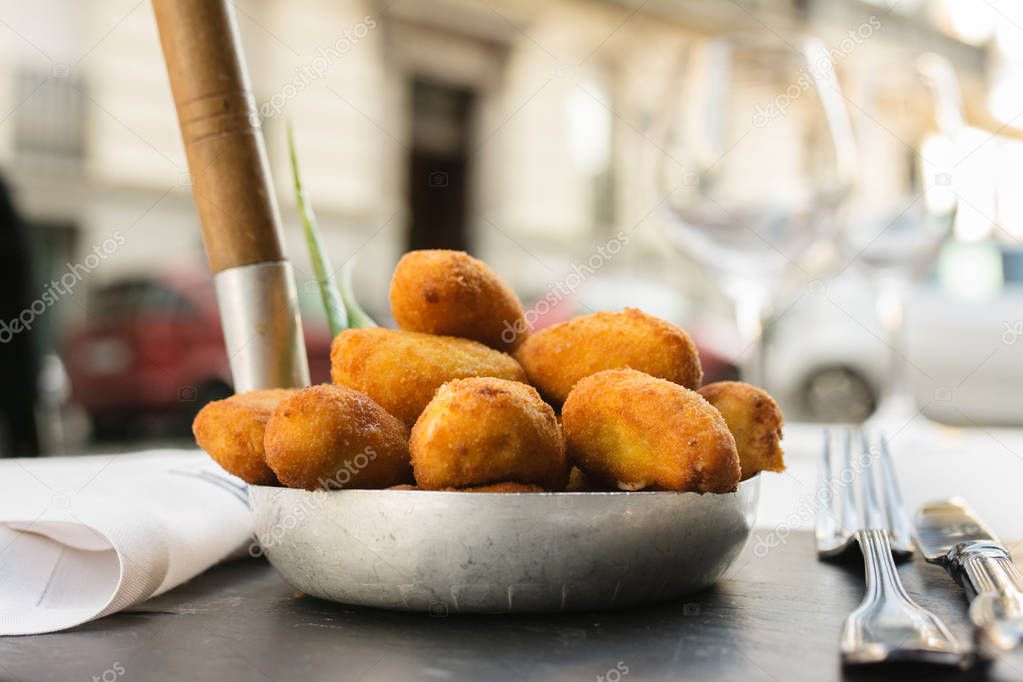 Spanish croquettes on place setting