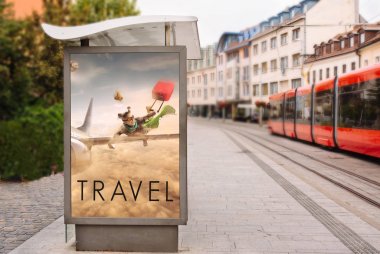 Billboards with advertising of conceptual travel. At city street clipart