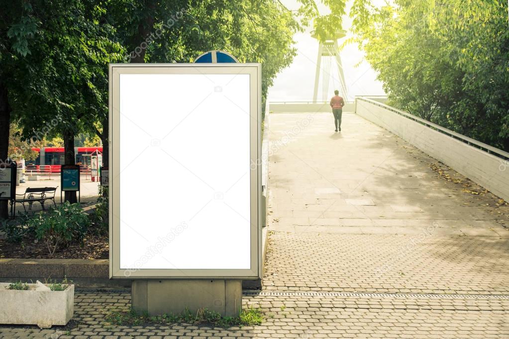 Blank mock up of vertical street poster billboard, daytime