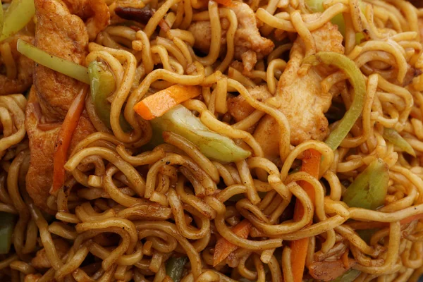 Kínai élelmiszer. Tészta sertés, zöldség — Stock Fotó