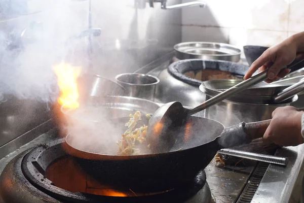 Close up of working chef preparing chinese food — Stock Photo, Image