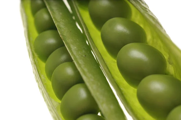 Fresh raw green peas within a pods on white background — Stock Photo, Image