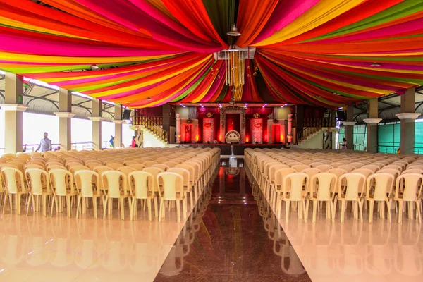 Floral wedding stage with colorful tent decoration at Indian wedding