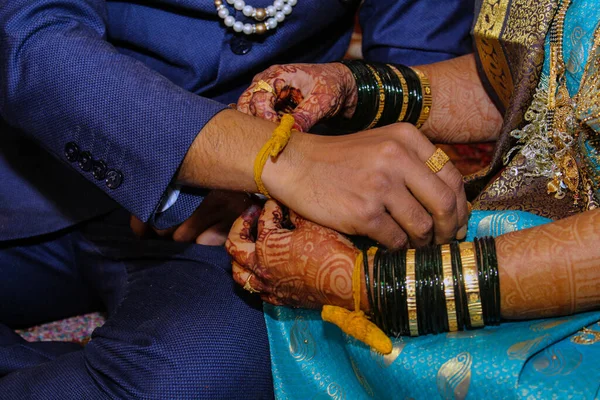 The Hands of bride and groom during Indian wedding rituals