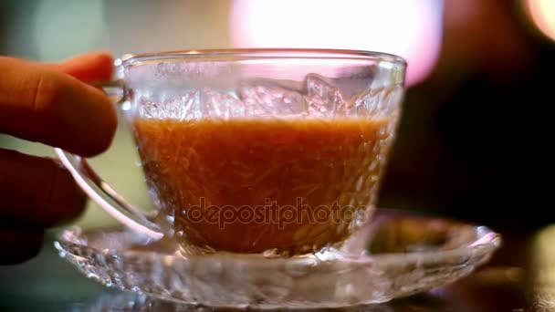 Drinking hot milk tea in cafe — Stock Video