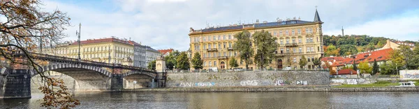 Prague, Czech Republic - October 10, 2017: Old and beautiful Legion Bridge is a historical granite bridge over the Vltava in Prague, Czech Republic, named after the Czechoslovak Legion. Panorama. — Stock Photo, Image