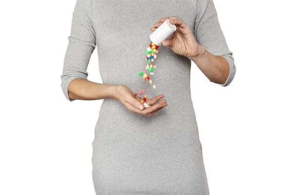 Cropped close up image of woman's hand pours the pills out of the bottle. — ストック写真