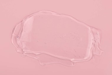 Pembe arka planda temiz jel izi var. Üst Manzara. Serum dokusu.