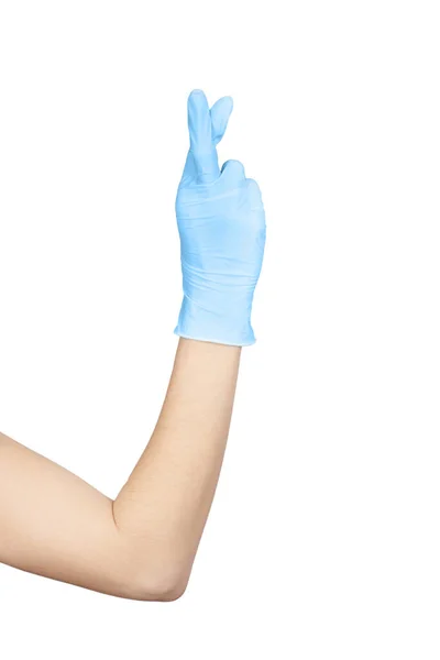 手举起来交上一只蓝色的乳胶一次性手套 上面有手指交叉的标志 与白色背景隔离 希望的概念 — 图库照片