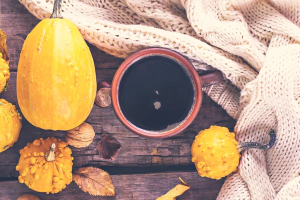 Cup of coffee, pumpkin, autumn leaves