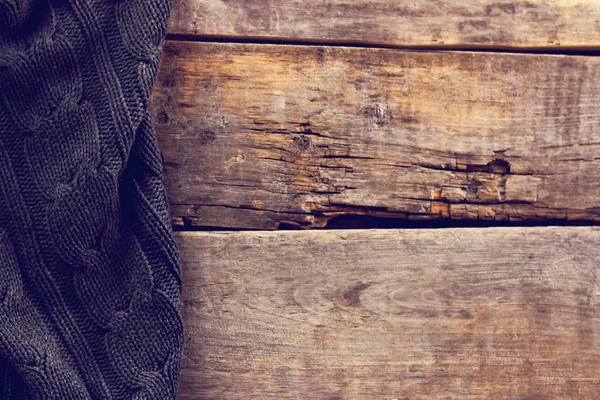 Punto a cuadros, suéter en tablas de madera viejas — Foto de Stock