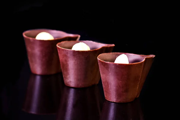 Chocolate candies  on a black — Stock Photo, Image