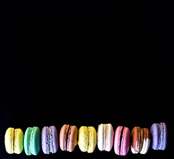 Multicolored macaroons  a black — Stock Photo, Image