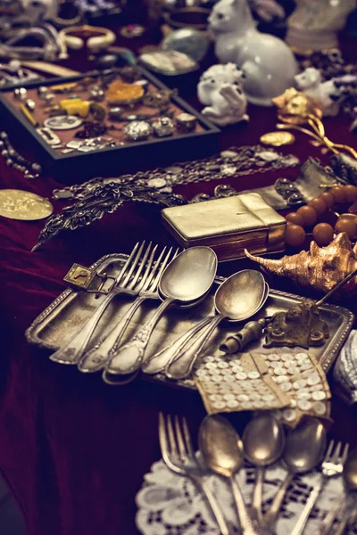 Old spoons and cutlery on the vintage market. Sale of antiques at the fair