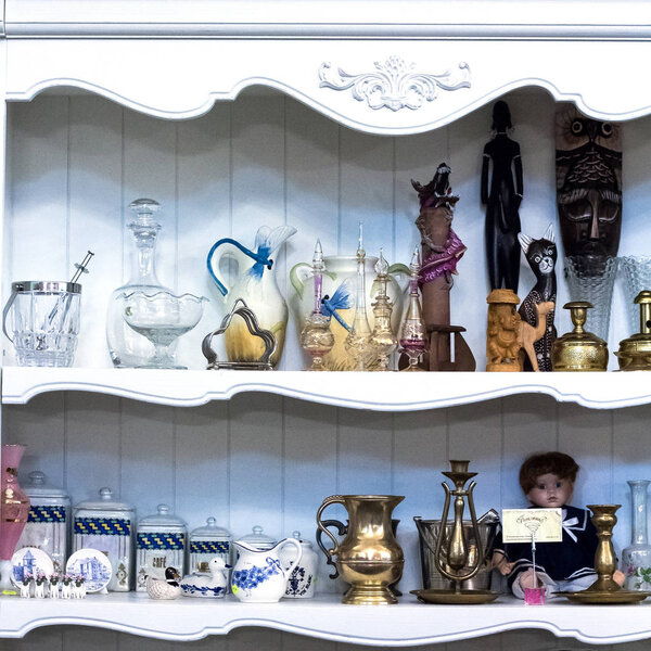Shelf in the closet, sideboard with antique things. 