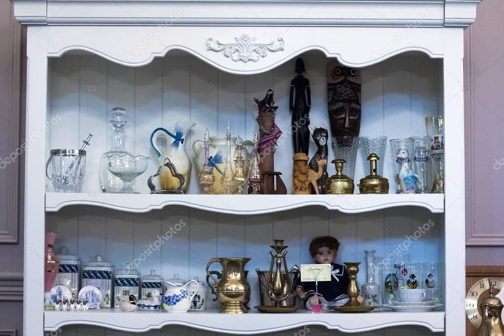 Shelf in the closet, sideboard with antique things. 