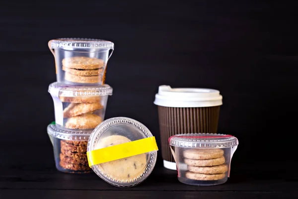 A paper cup with coffee and a box with biscuits — Stock Photo, Image