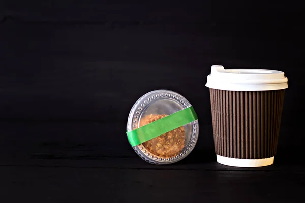 A paper cup with coffee and a box with biscuits — Stock Photo, Image