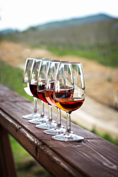 Glasses with wine. Red, pink, white wine in glasses.